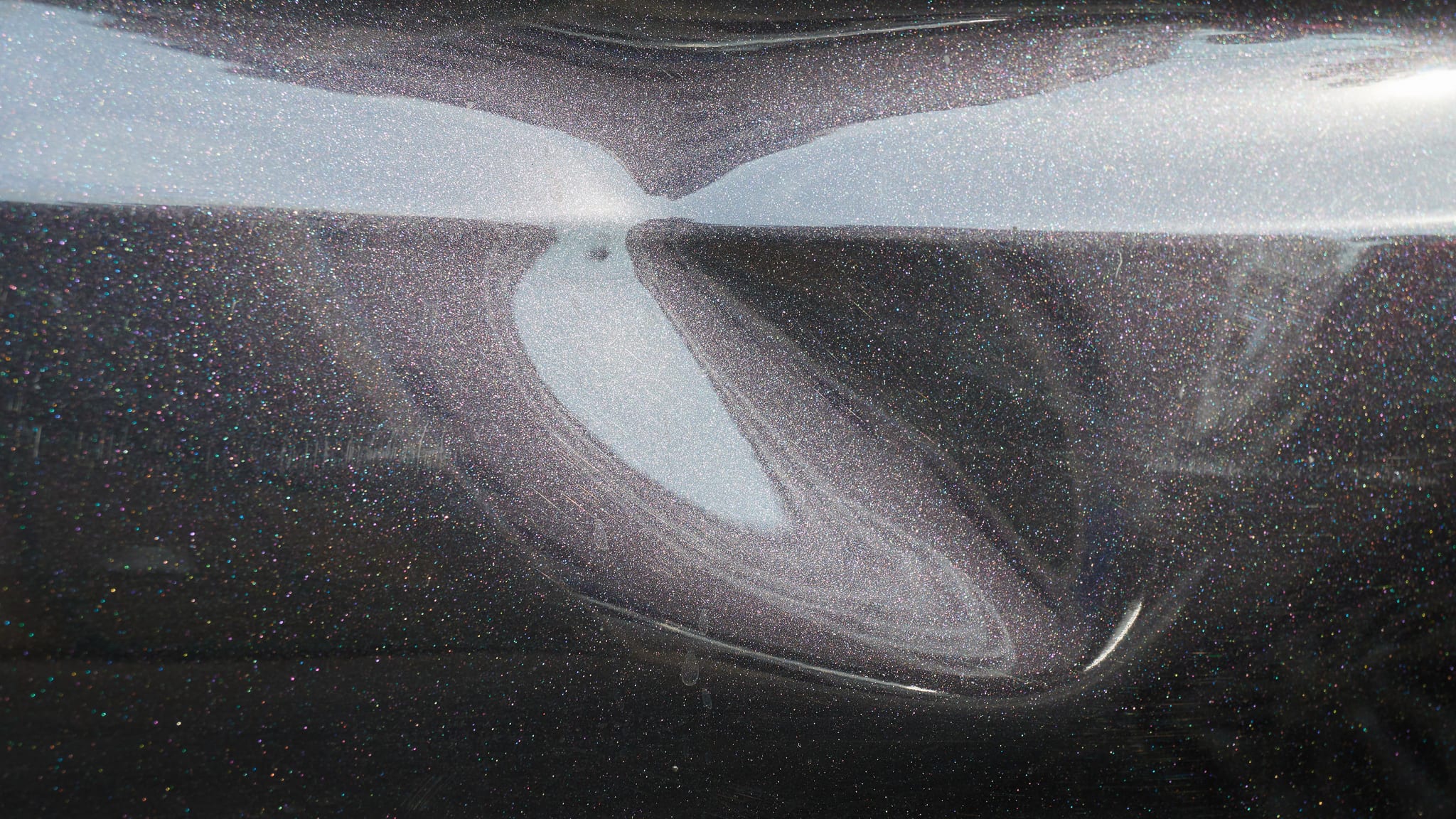 a black car body dent needs a repair
